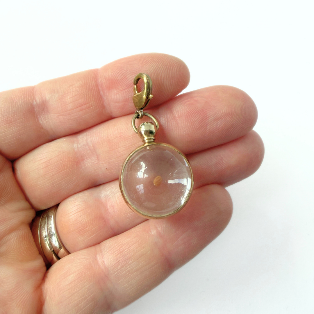 Vintage mustard seed transparent orb charm