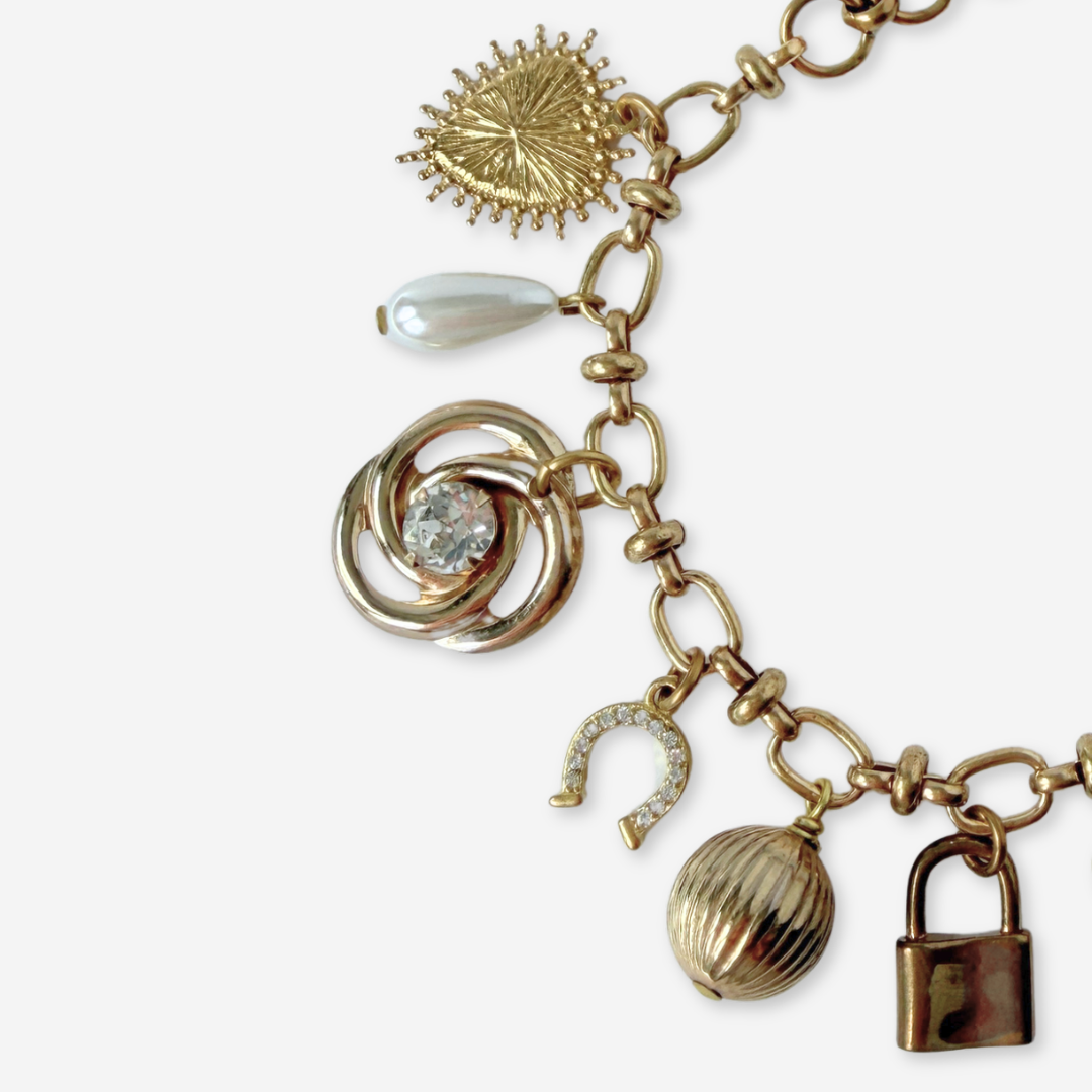 Repurposed vintage mixed neutral charm bracelet