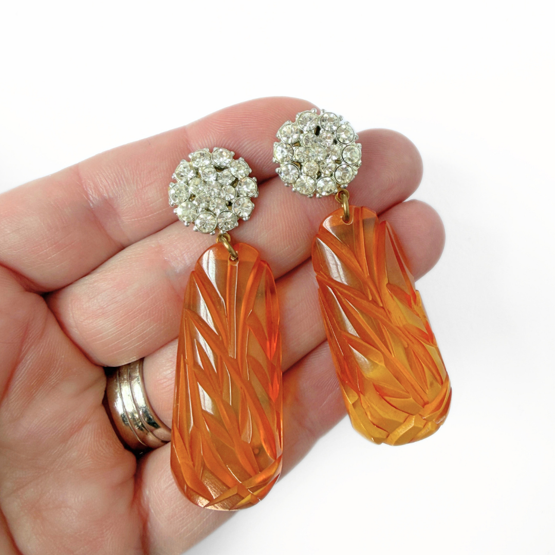 Refashioned vintage orange carved bakelite statement earrings with rhinestone posts