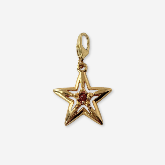 Vintage small gold plated star charm with red center