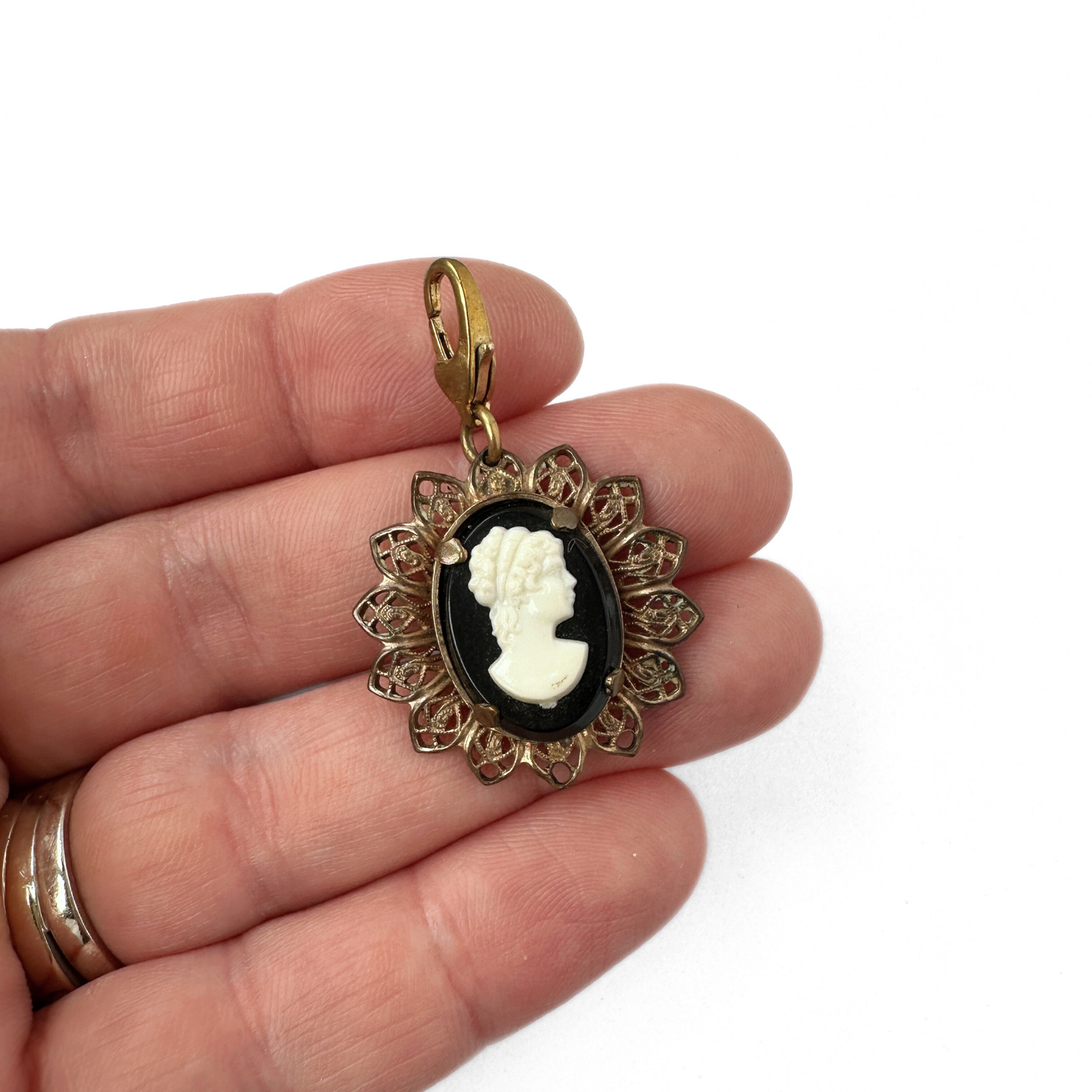 Vintage black and white cameo charm with antique brass fiigree setting