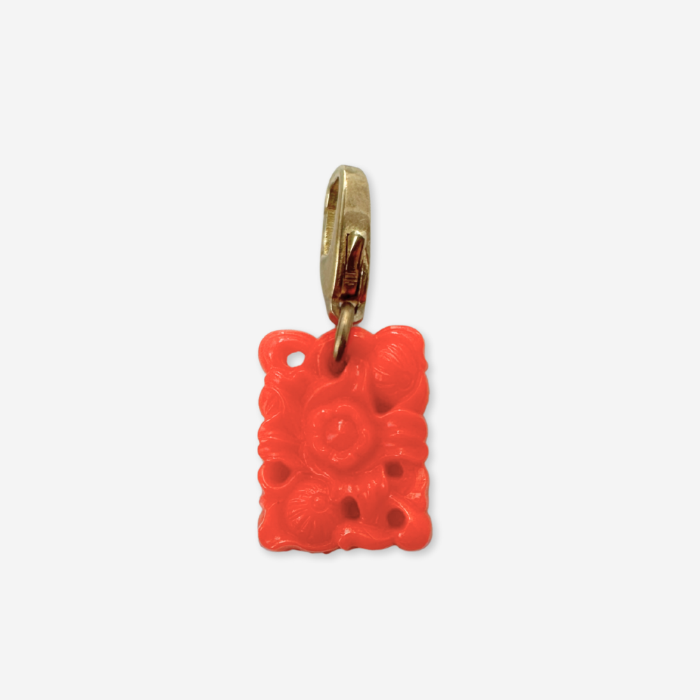Small vintage coral pierced glass floral charm
