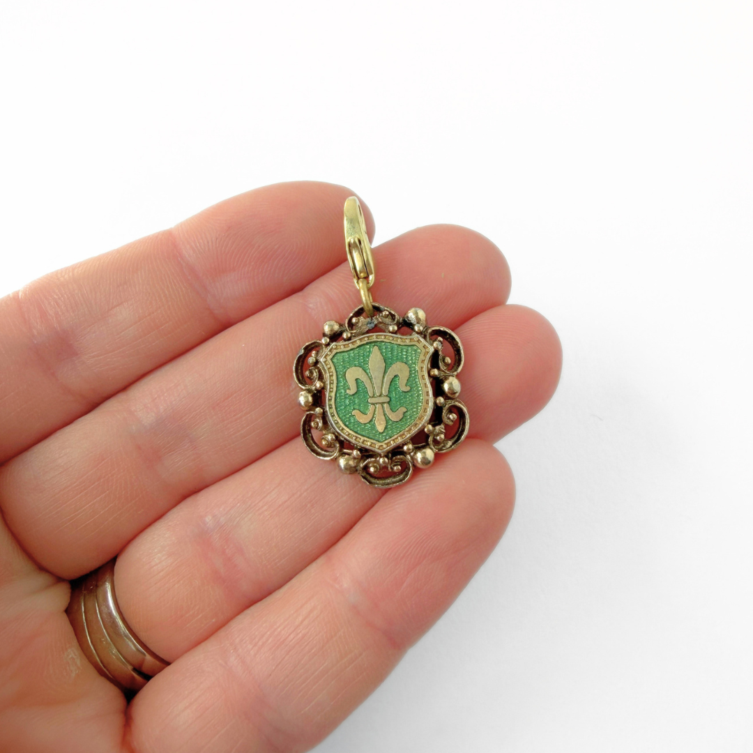Vintage gold and green enamel fleur de lis crest charm