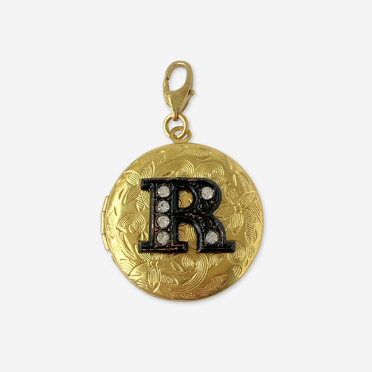 Vintage brass circular locket charm with black rhinestone letter "R"