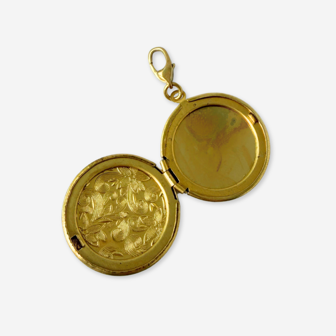 Vintage brass circular locket charm with black rhinestone letter "R"