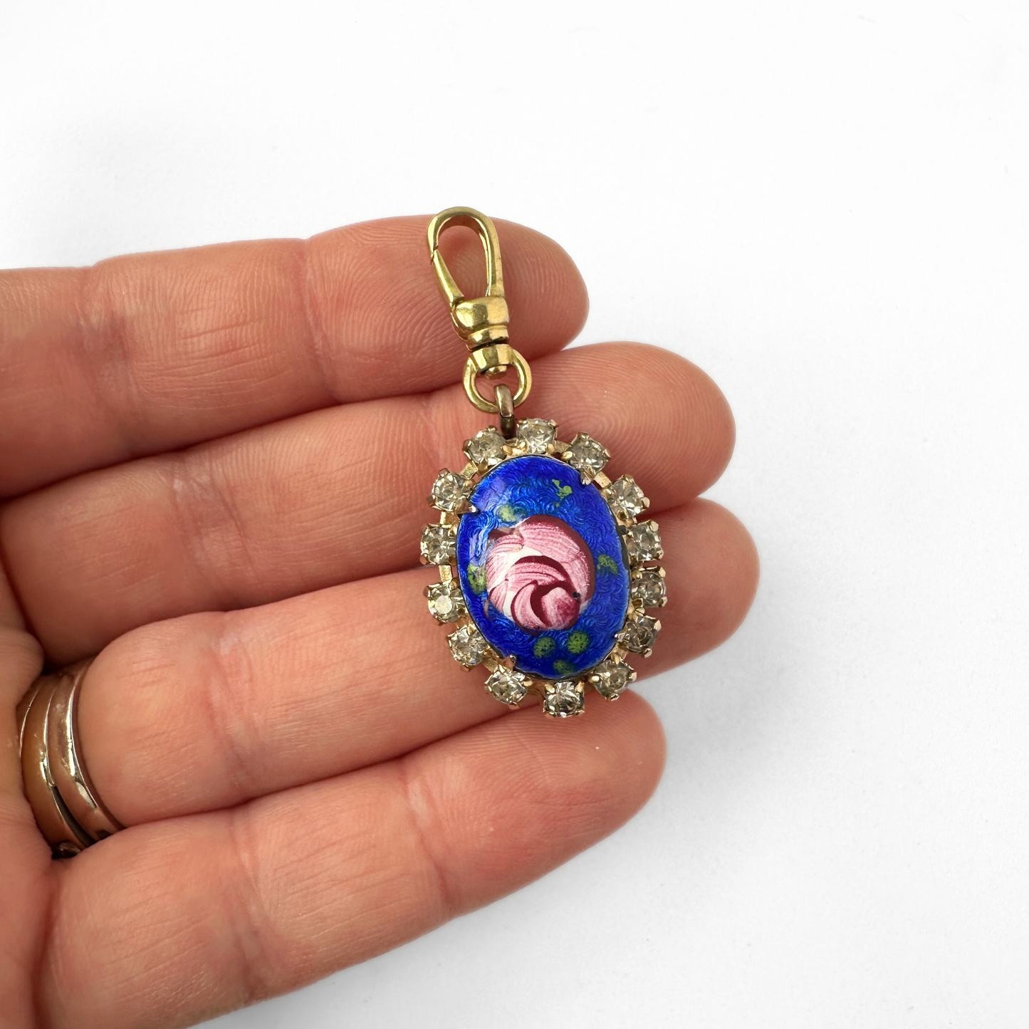 Vintage blue hand painted floral and rhinestone oval charm.