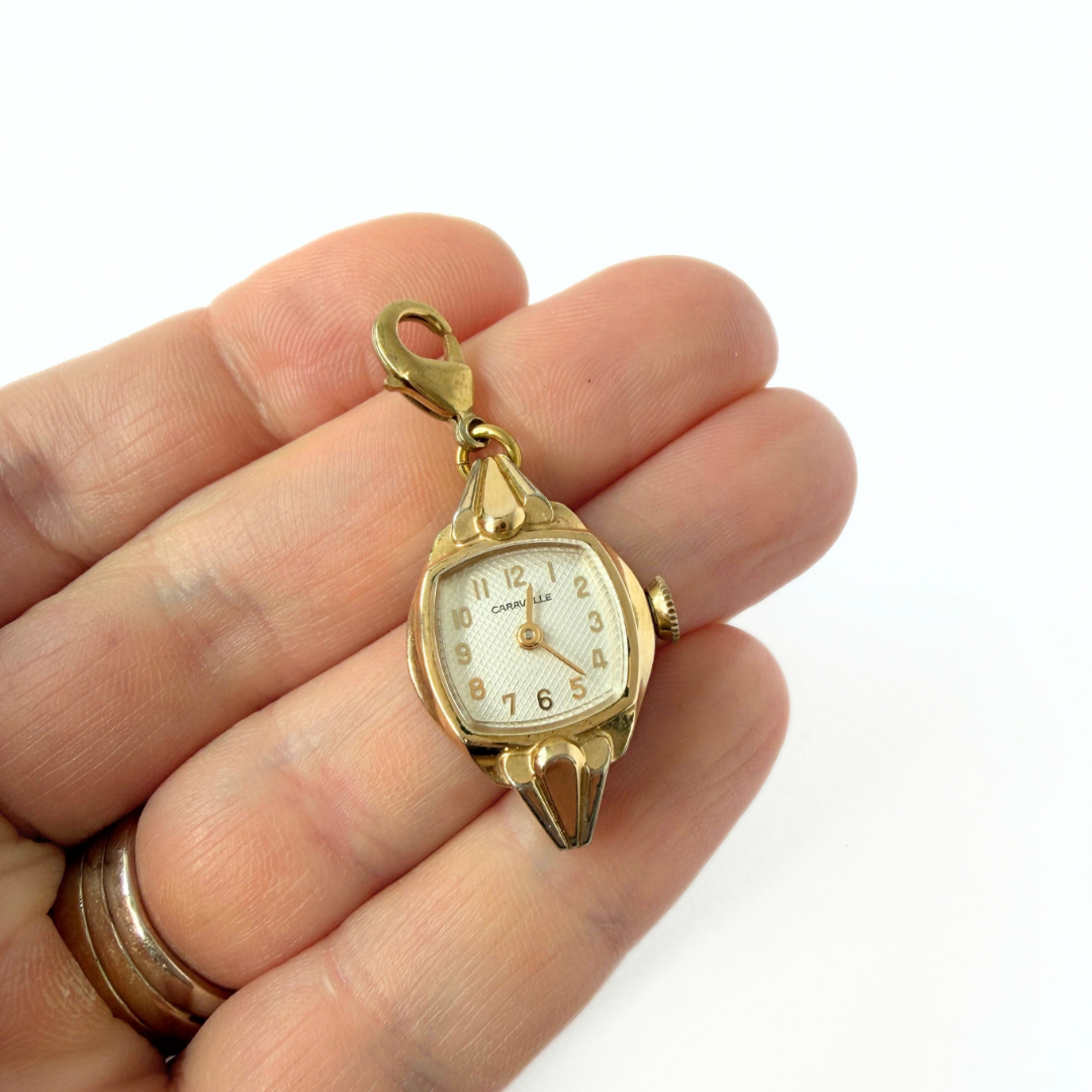 Vintage gold plated "Caravelle" watch face charm