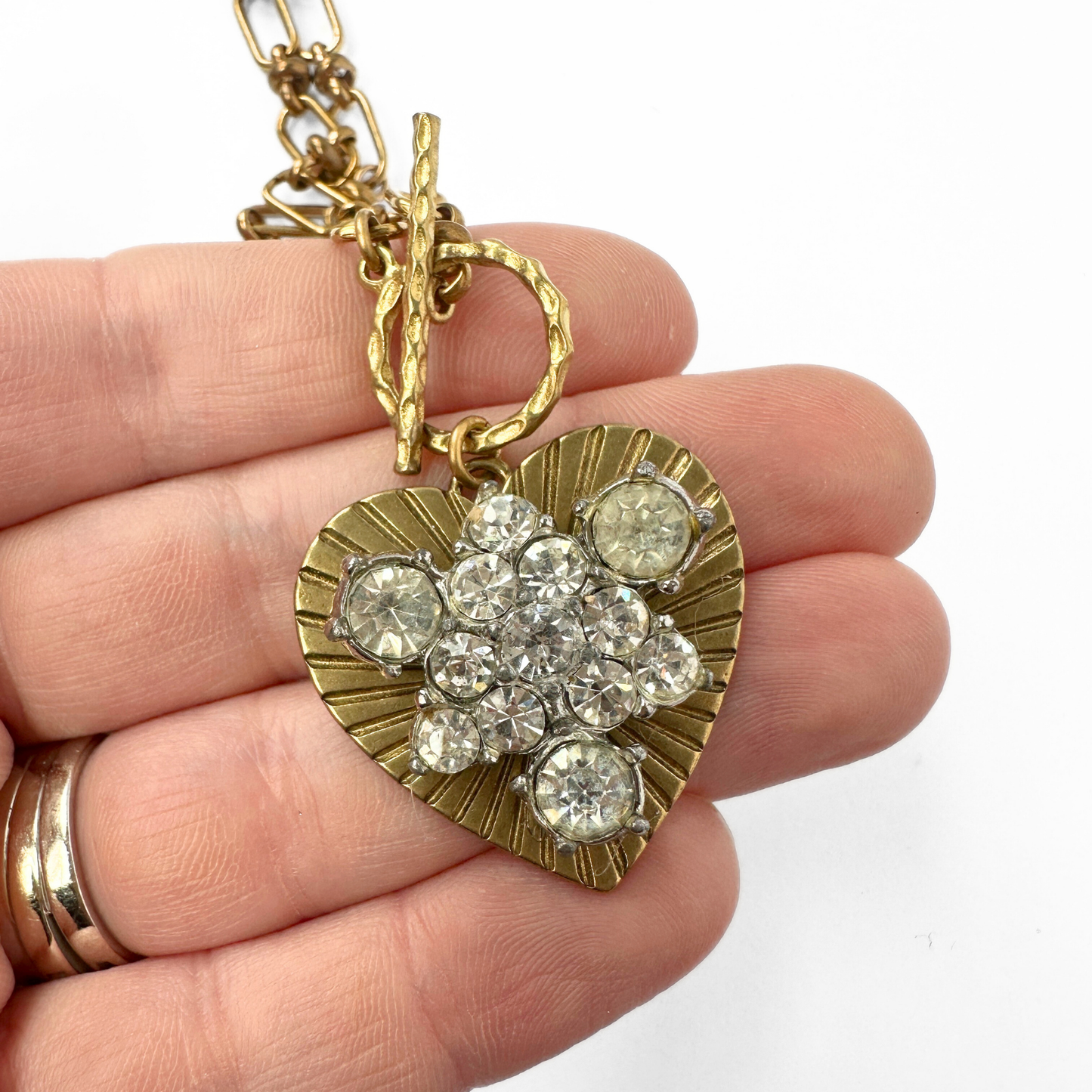 Large solid brass heart pendant with vintage clear rhinestone embellishment on brass toggle chain