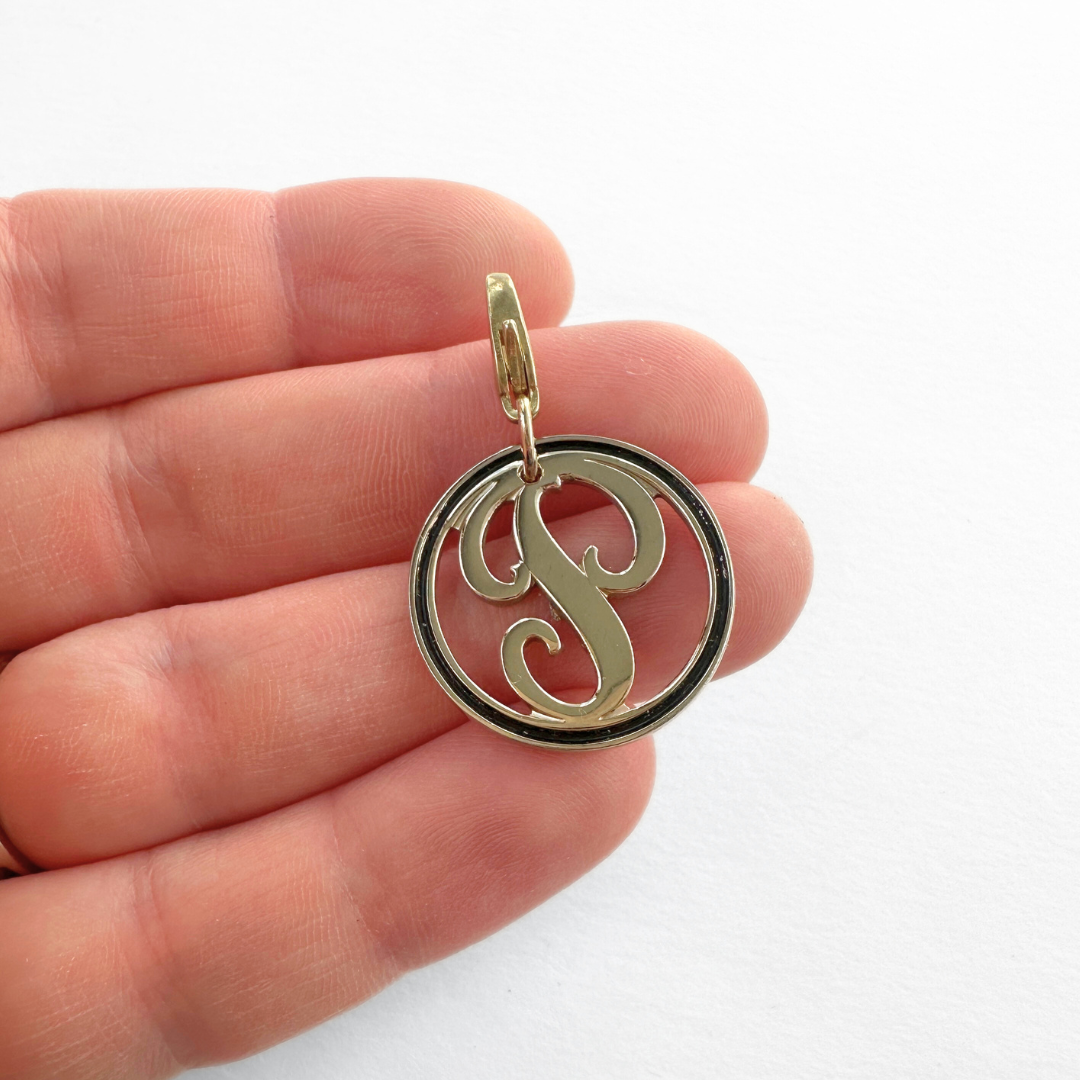 Vintage circular gold and black enamel letter "P" charm
