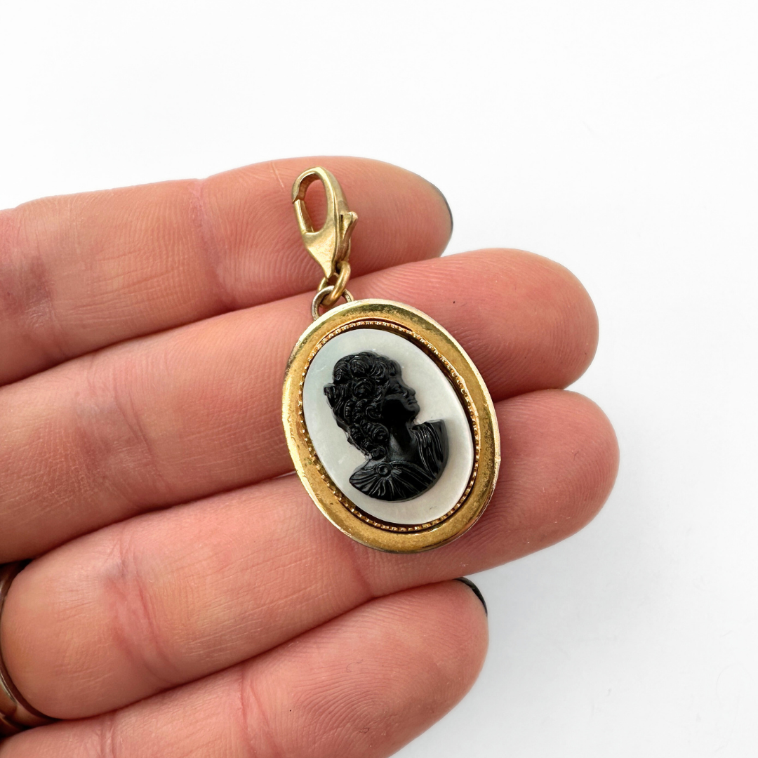 Vintage oval mother of pearl and black acrylic cameo charm