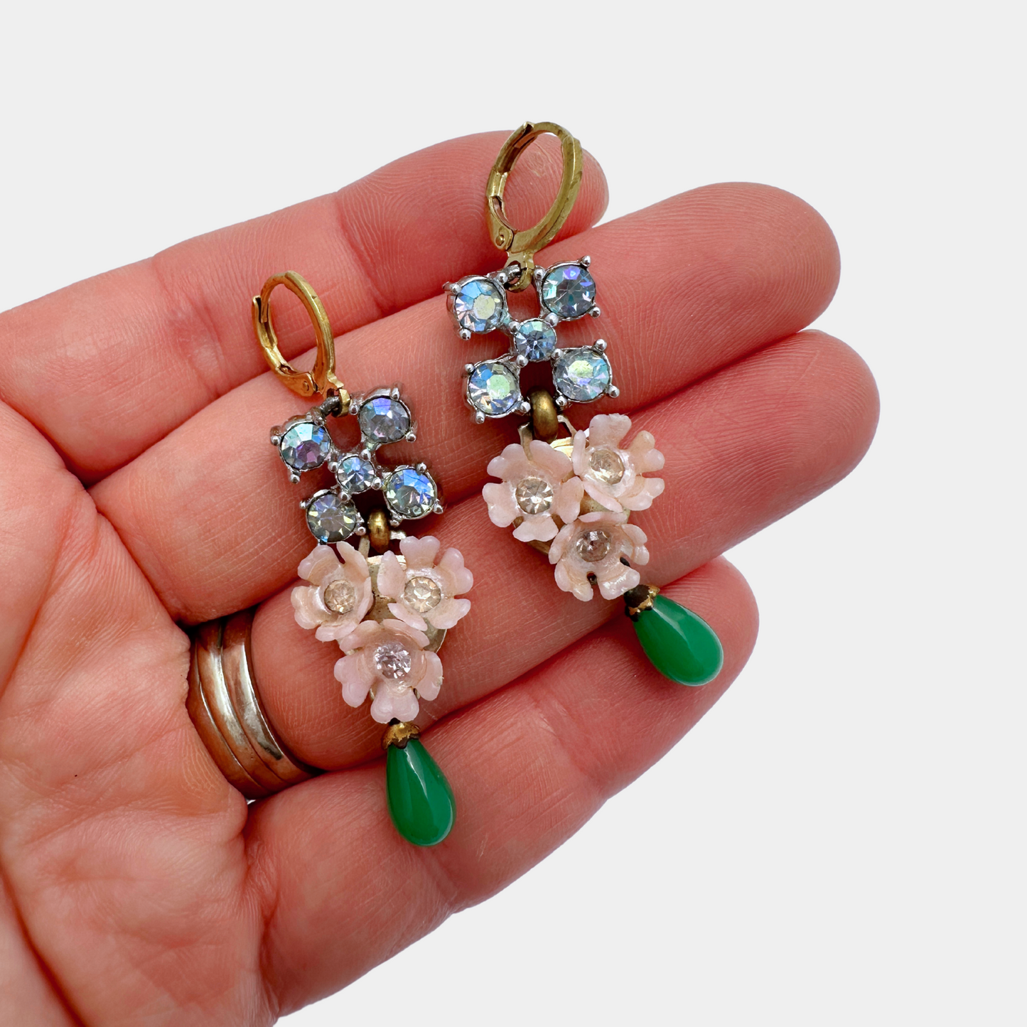 Refashioned vintage iridescent rhinestone, pink floral, and green teardrop assemblage earrings