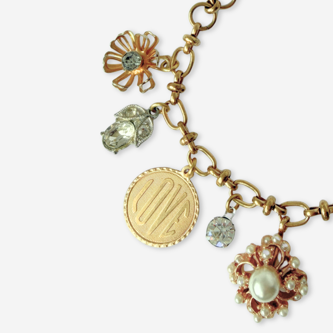 Repurposed vintage mixed neutral charm bracelet