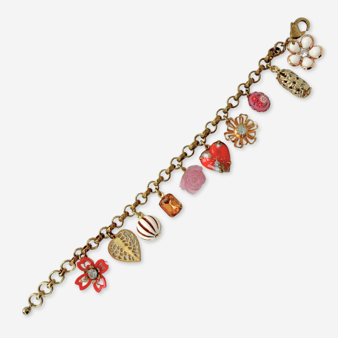Red and pink repurposed vintage mixed charm bracelet