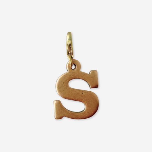 Gold letter 'S' pendant on a white background