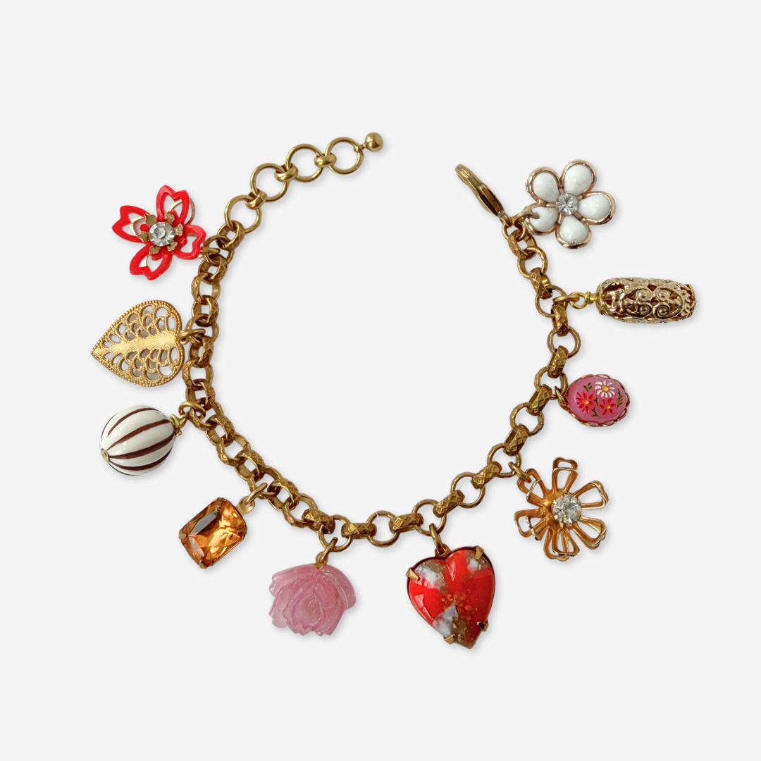 Red and pink repurposed vintage mixed charm bracelet