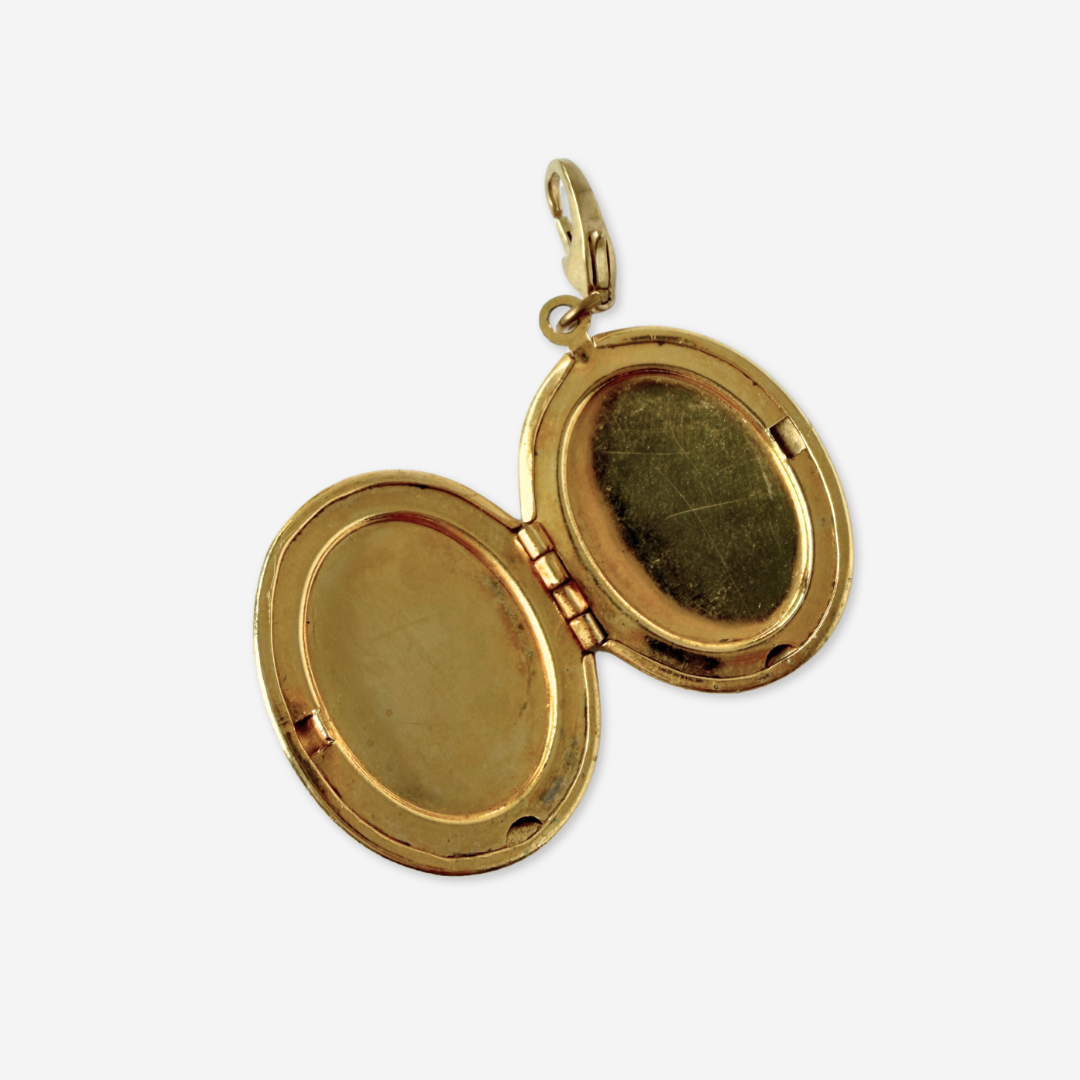 Vintage brass oval locket charm with black rhinestone letter "S"