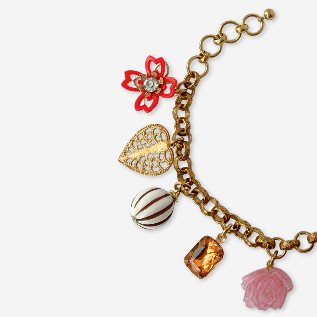 Red and pink repurposed vintage mixed charm bracelet