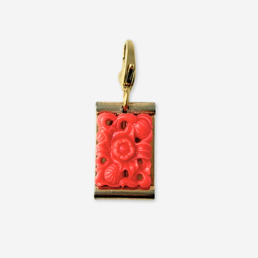 Vintage coral pierced glass floral charm