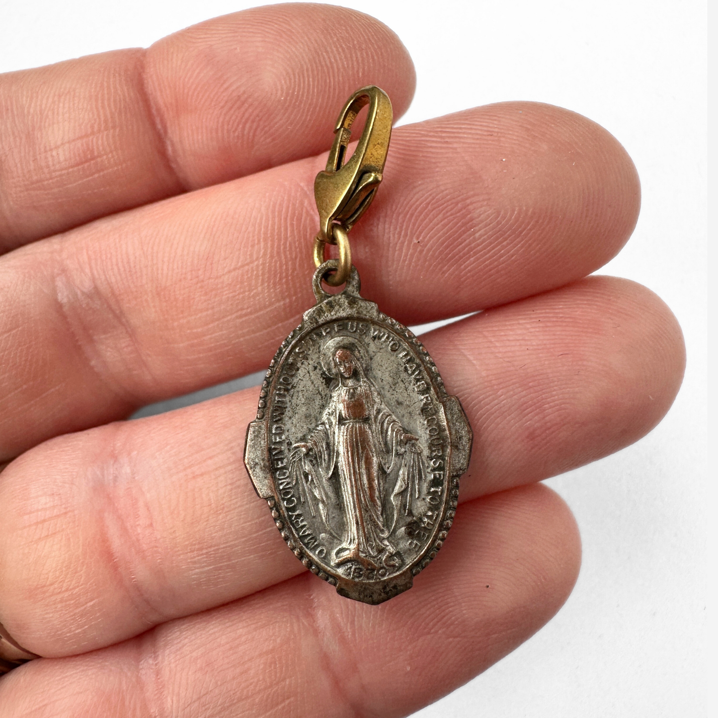 Vintage aged silver tone miraculous medal charm with brass clasp