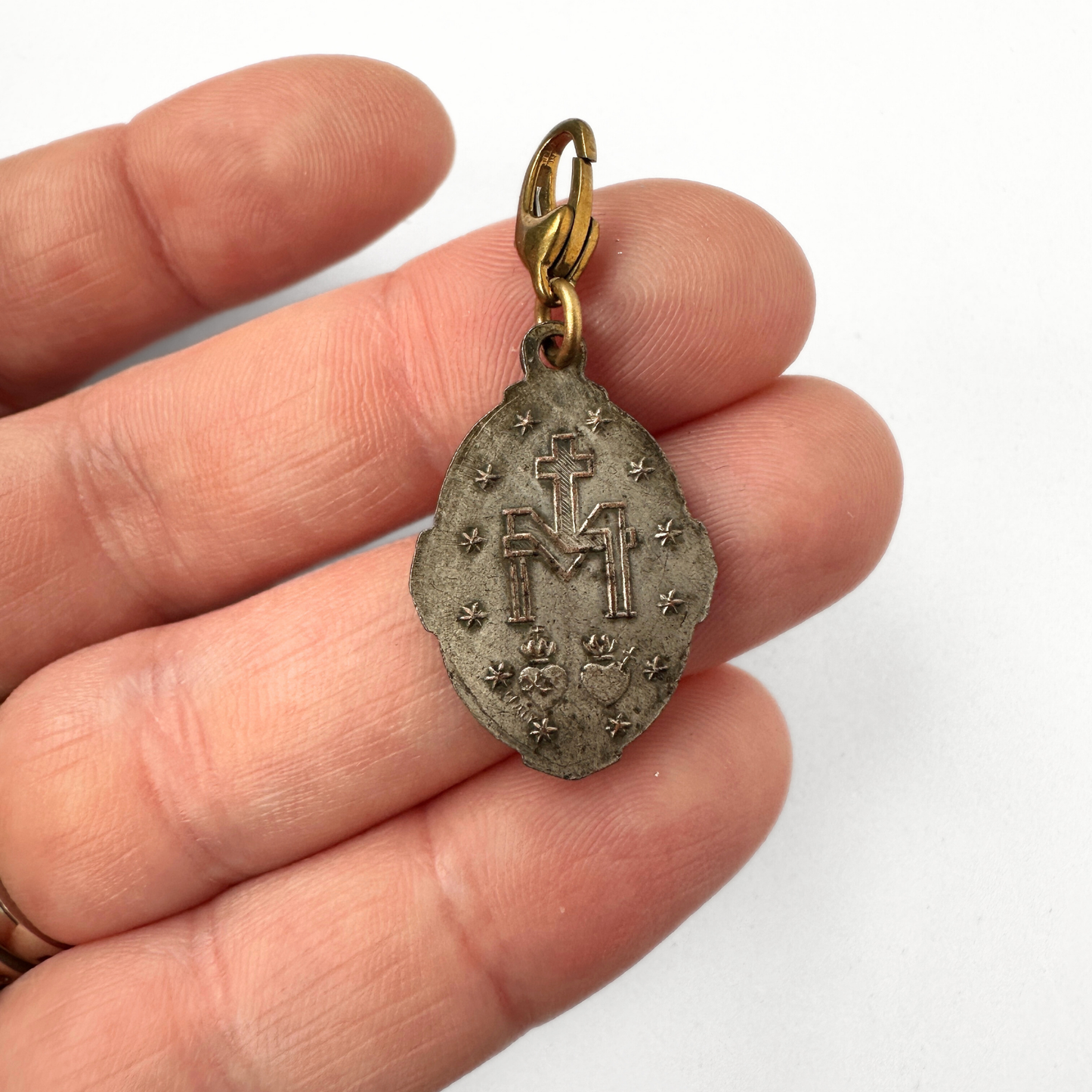 Vintage aged silver tone miraculous medal charm with brass clasp
