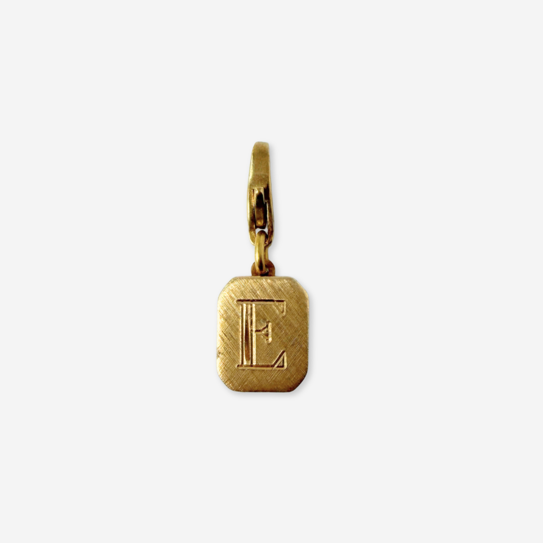 Small vintage gold octagonal "E"monogram charm