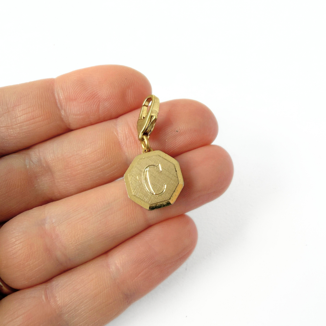 Small vintage gold octagonal "C"monogram charm