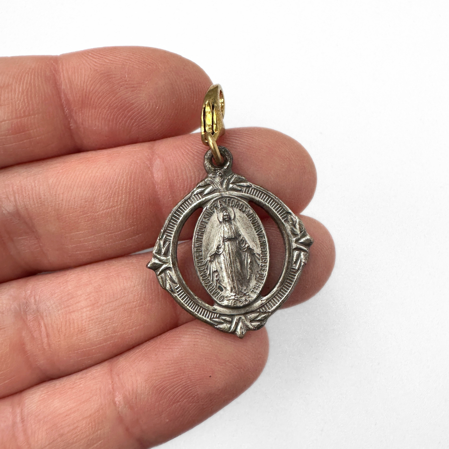 Vintage silver tone ornate miraculous medal charm with brass clasp