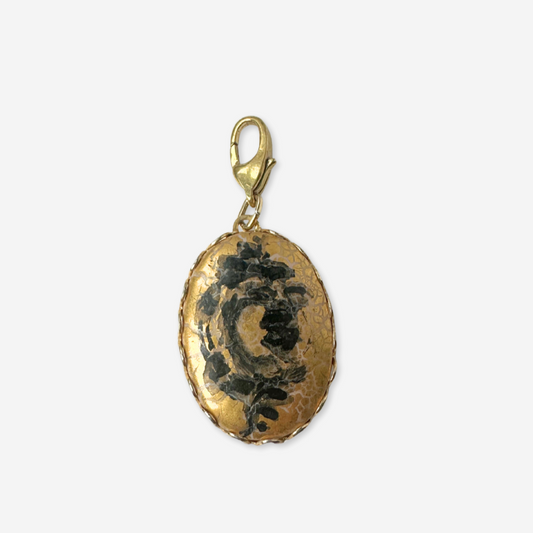 Vintage hand painted black rose on gold oval charm