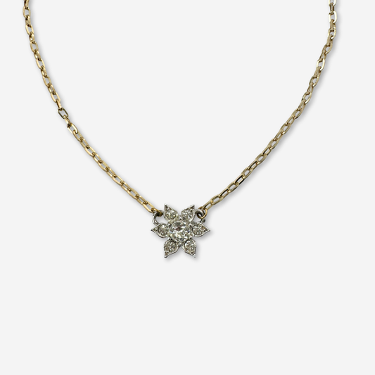 Small clear vintage rhinestone flower pendant on thin gold plated chain