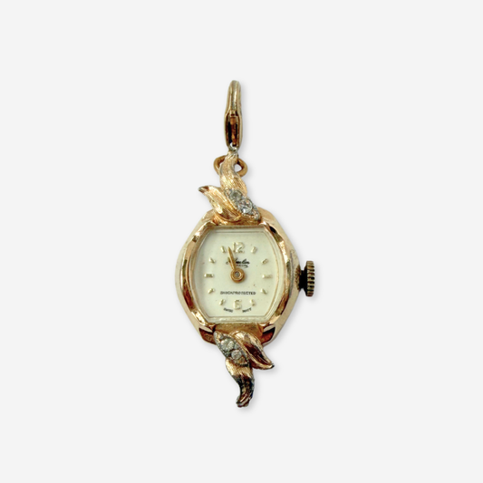 Vintage gold tone Swiss watch face charm