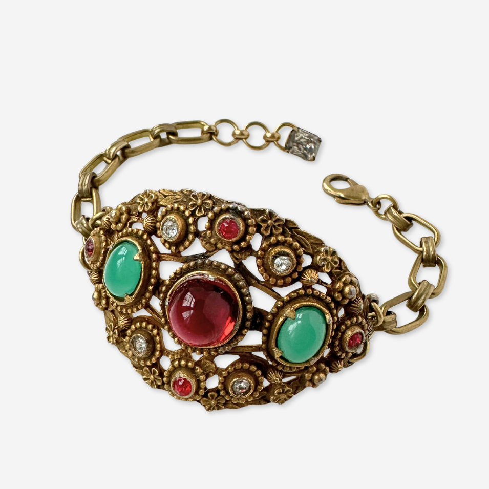 Antique ornate bracelet with red and jade green stones