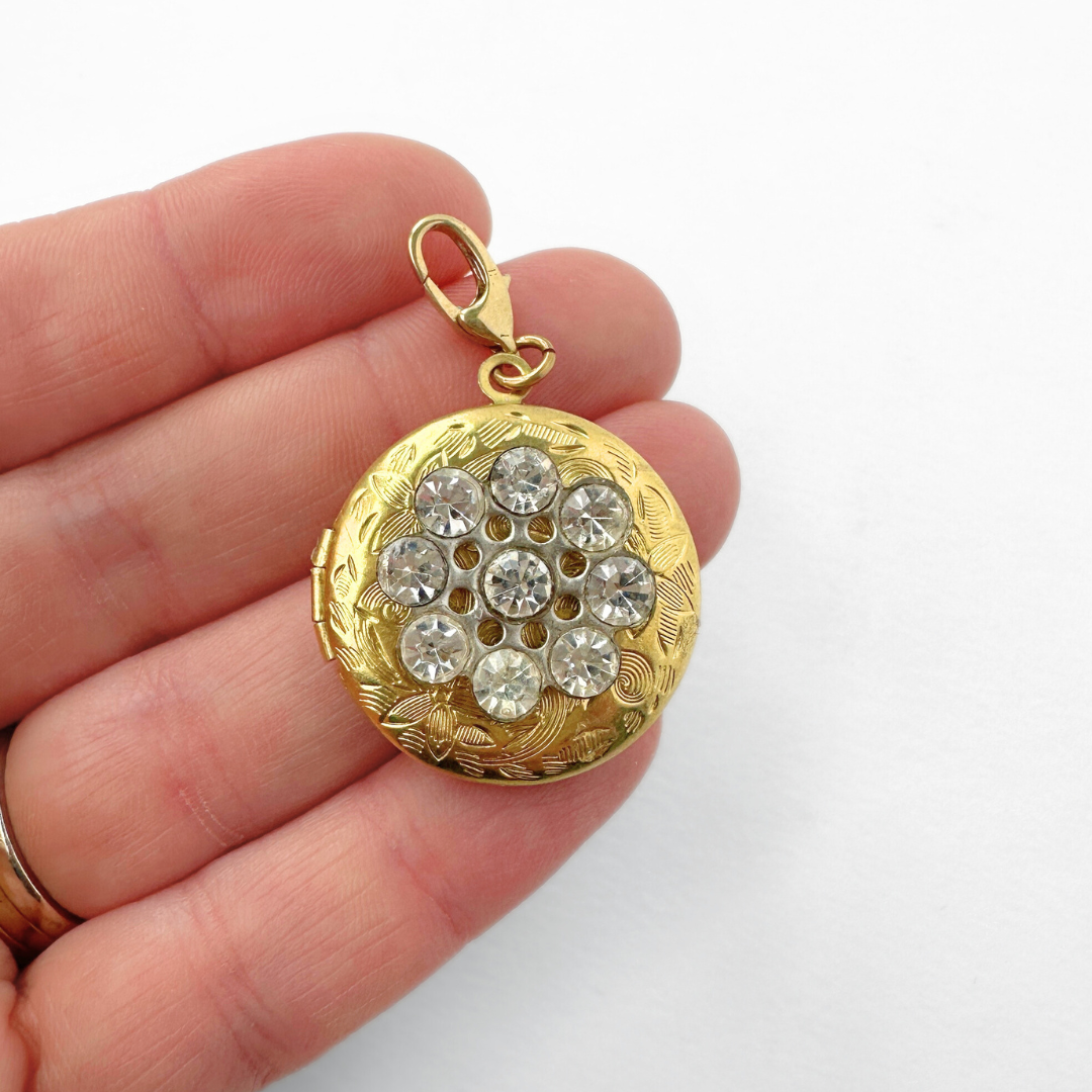 Vintage etched brass circular locket charm with clear rhinestones