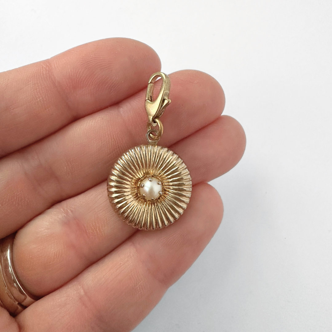 Small vintage ribbed circular gold charm with pearl center