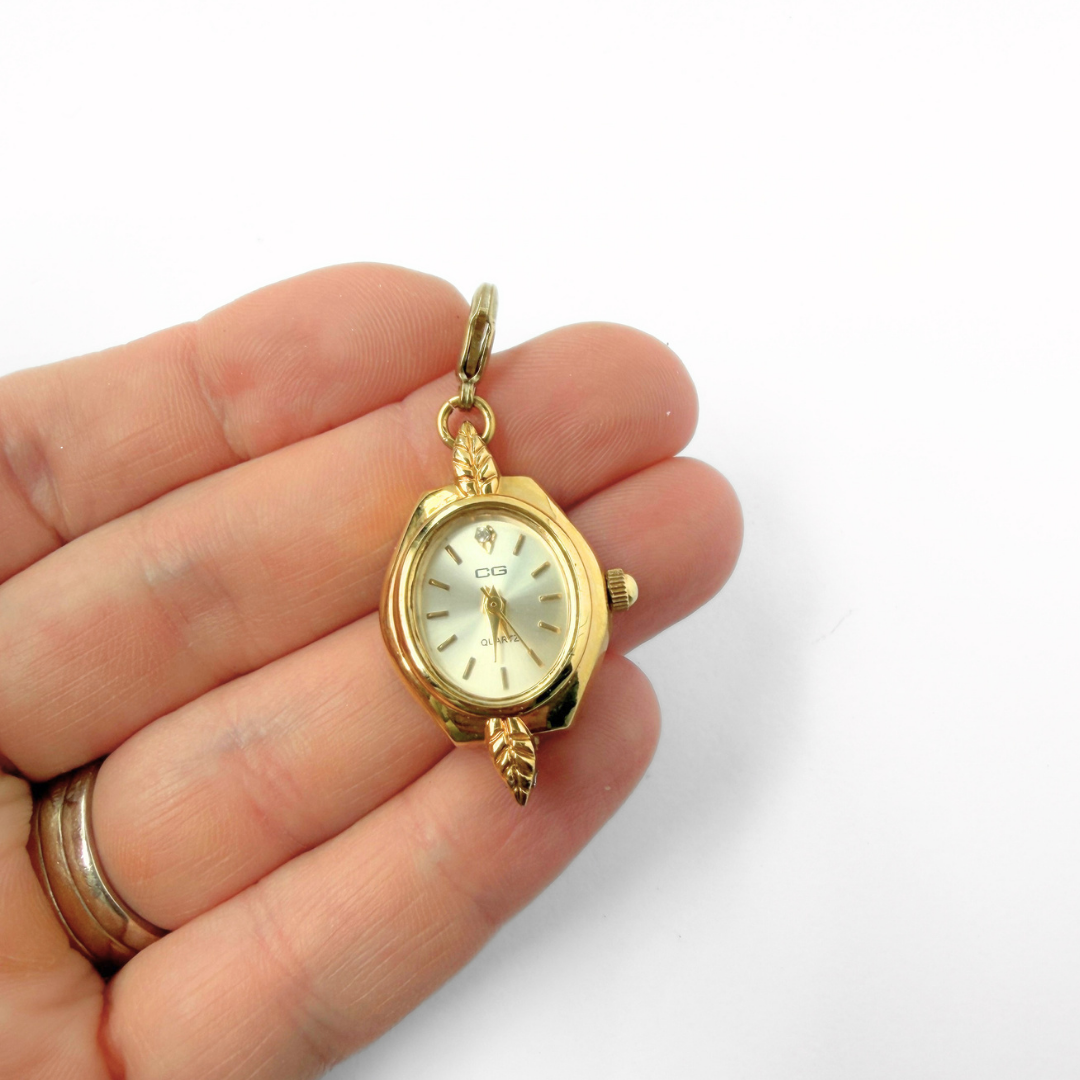 Vintage gold tone  "CG" watch face charm