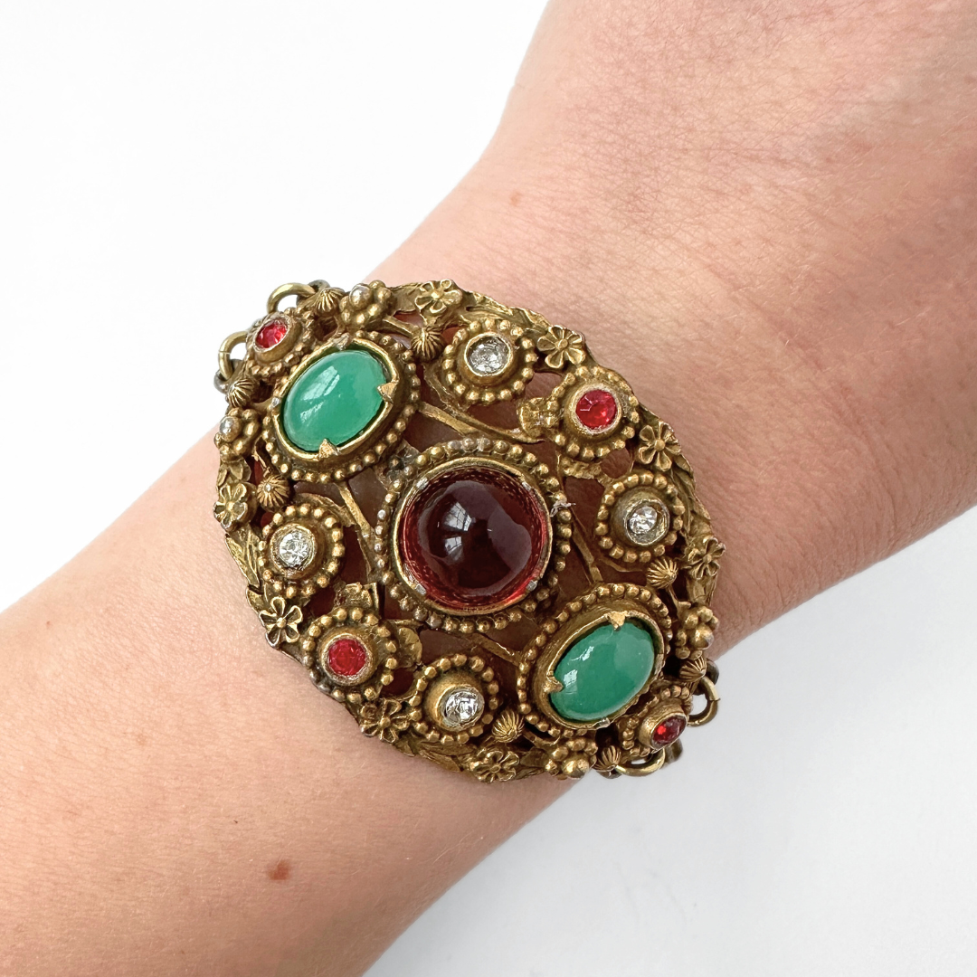Antique ornate bracelet with red and jade green stones