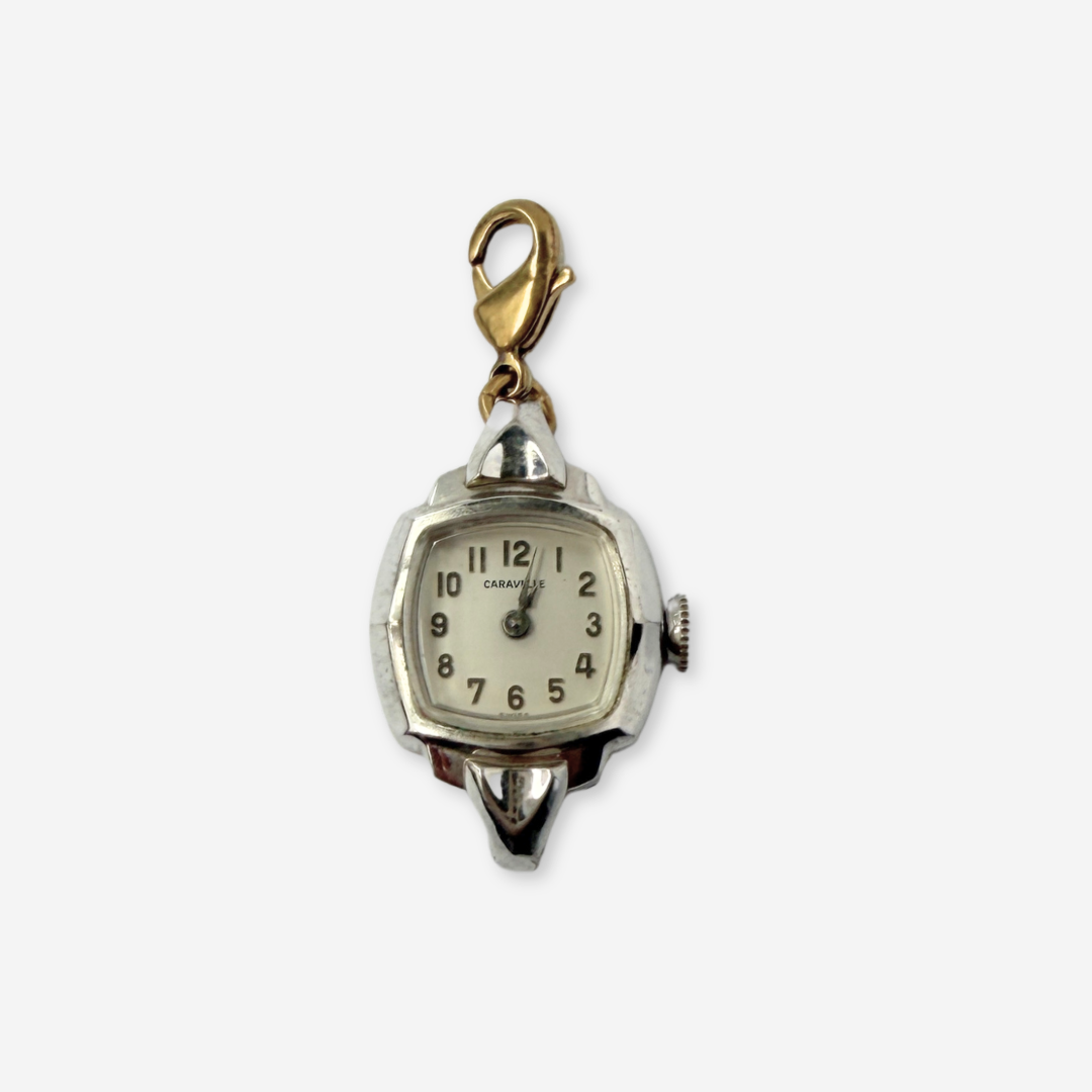Vintage silver tone  "Caravelle" Swiss watch face charm