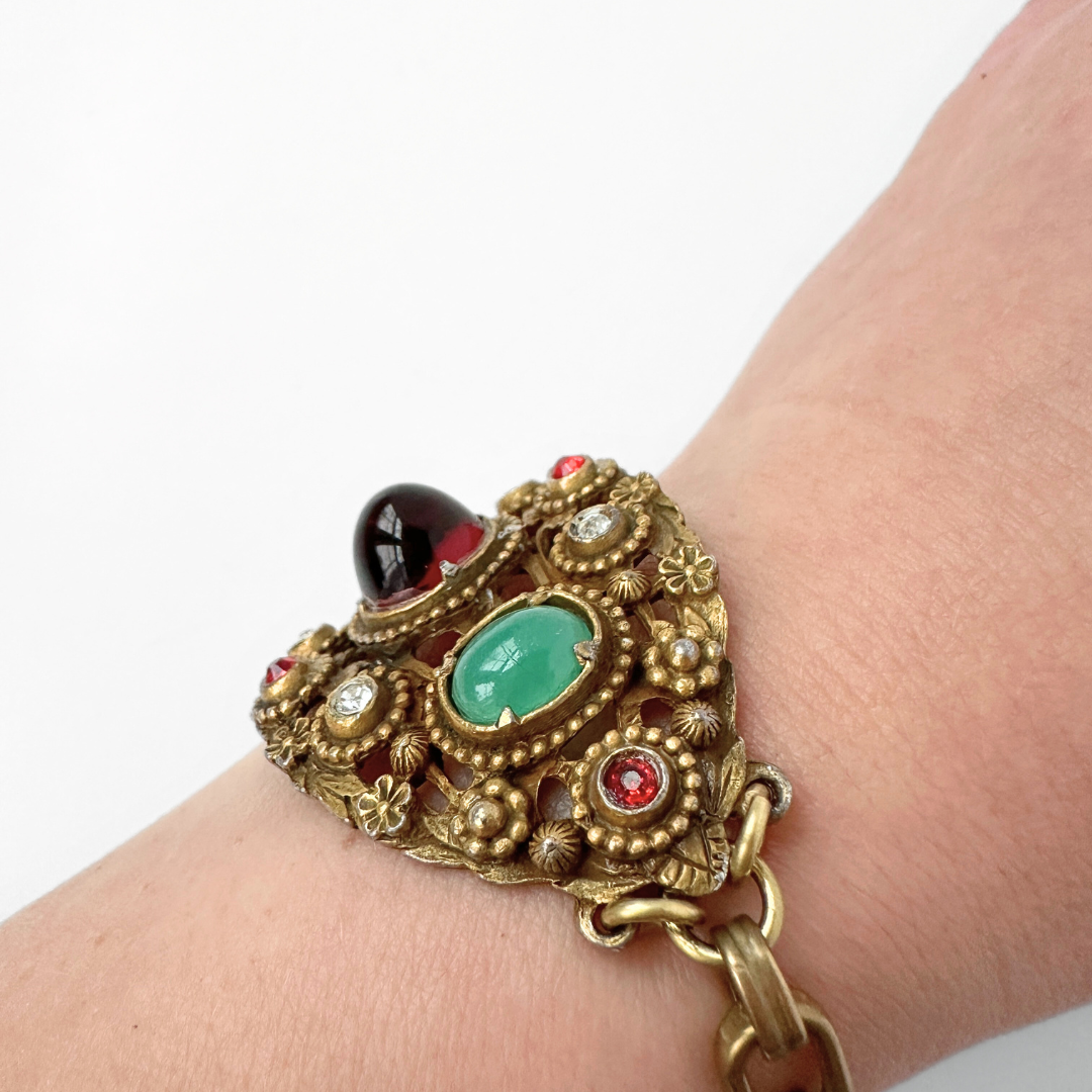 Antique ornate bracelet with red and jade green stones