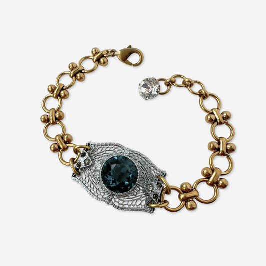 Repurposed silver filigree bracelet with montana blue centerpiece