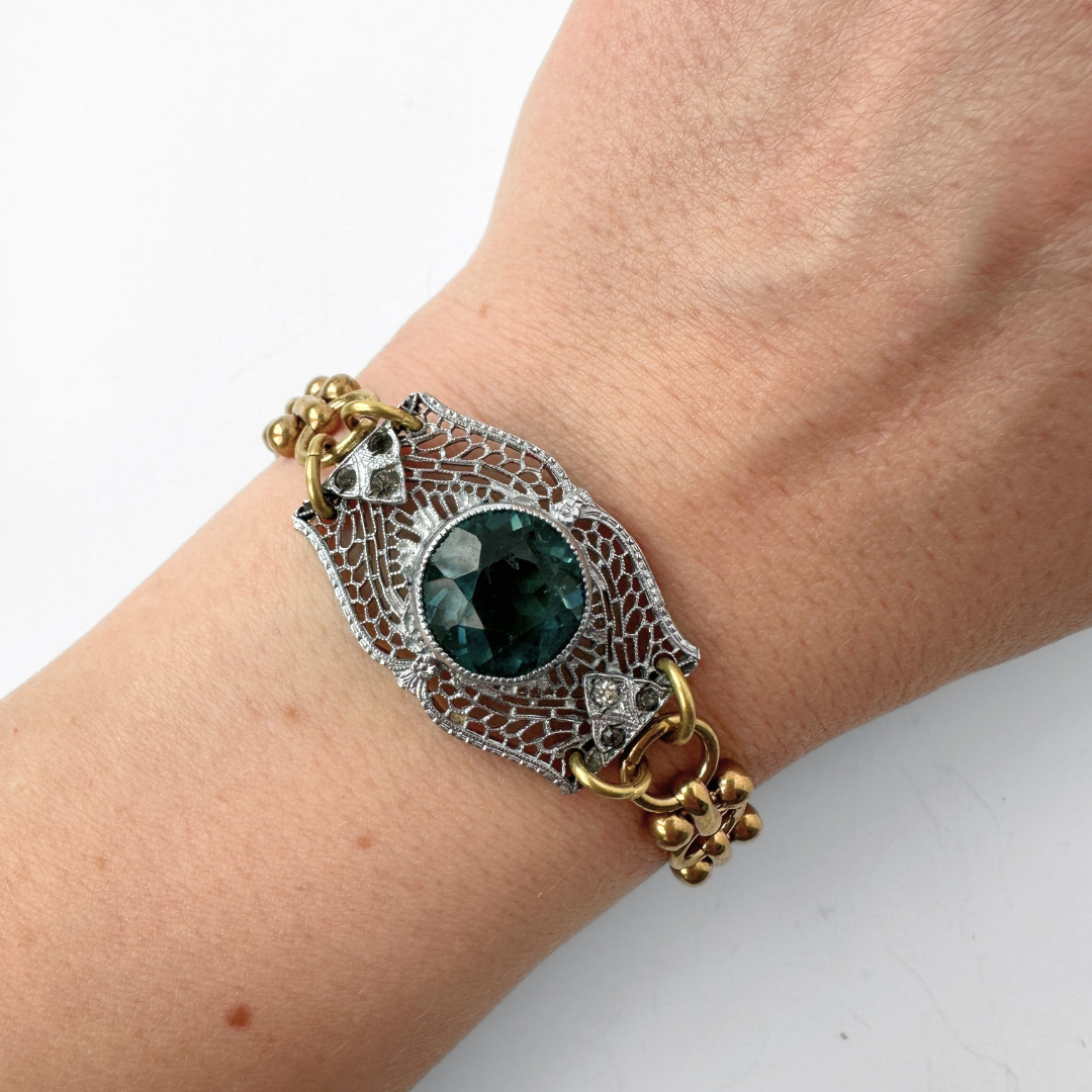 Repurposed silver filigree bracelet with montana blue centerpiece