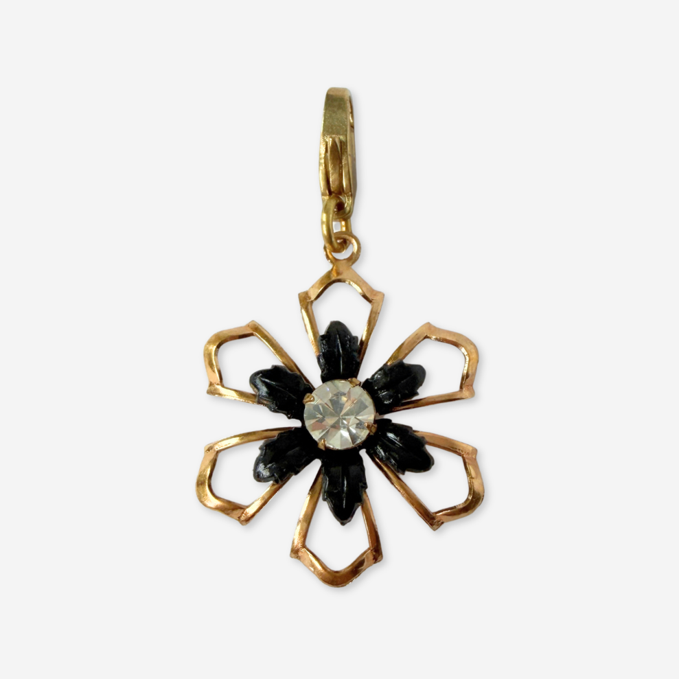 Vintage black and gold open flower charm with rhinestone center
