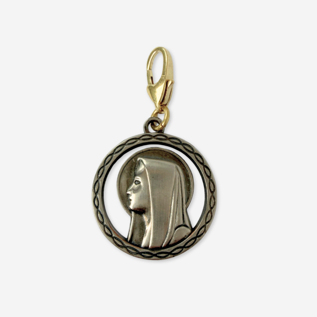 Vintage aged silver Blessed mother circular charm