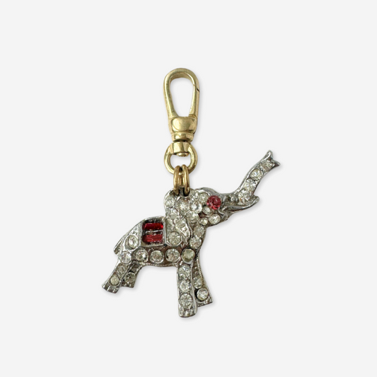 Decorative elephant keychain with gemstones on a white background