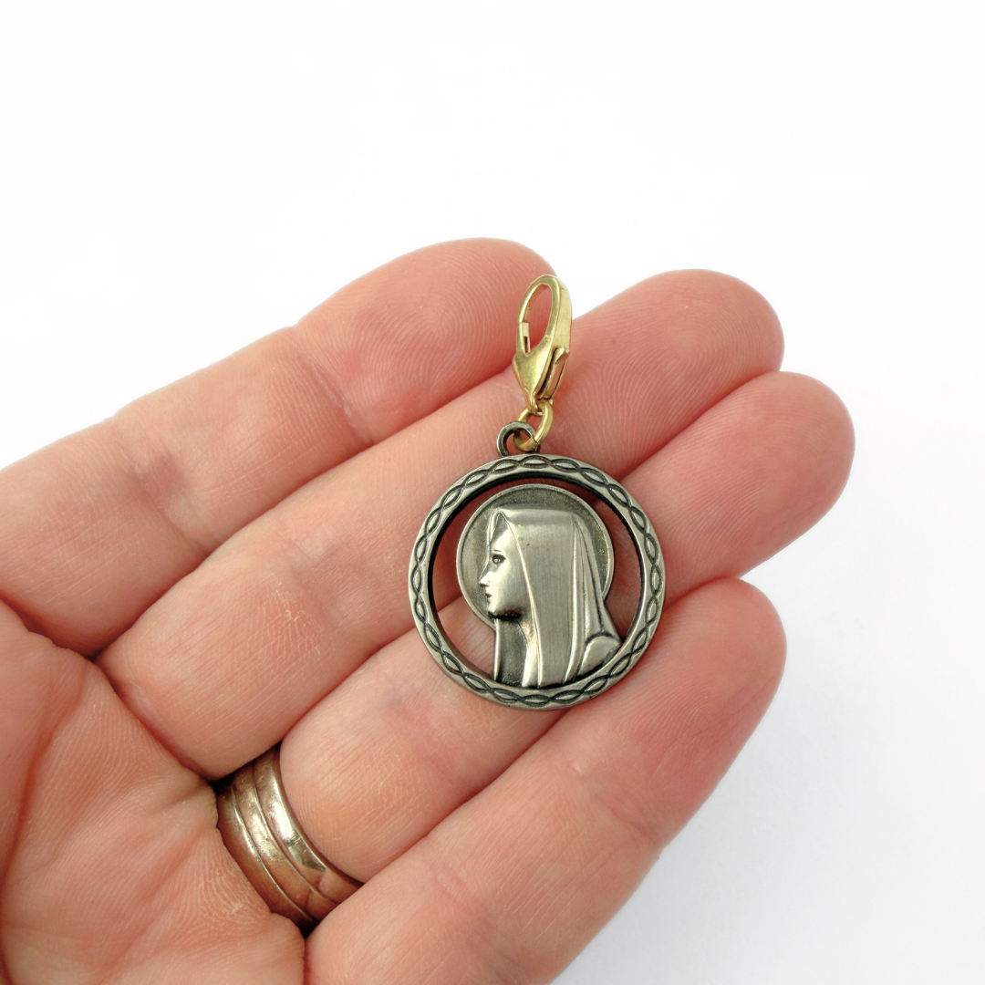 Vintage aged silver Blessed mother circular charm