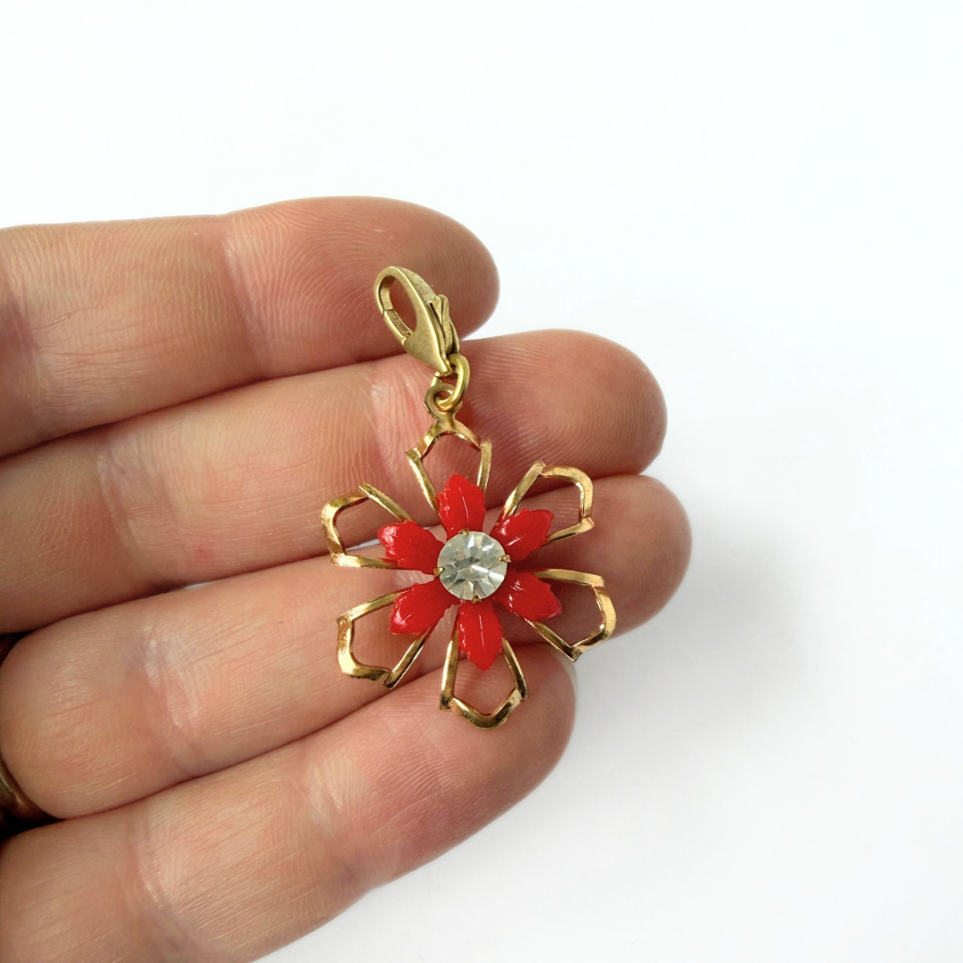 Vintage red and gold open flower charm with rhinestone center