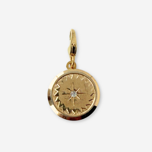 Vintage gold plated circular charm with rhinestone center