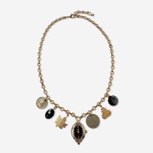 Repurposed vintage mixed charm necklace on brass chain
