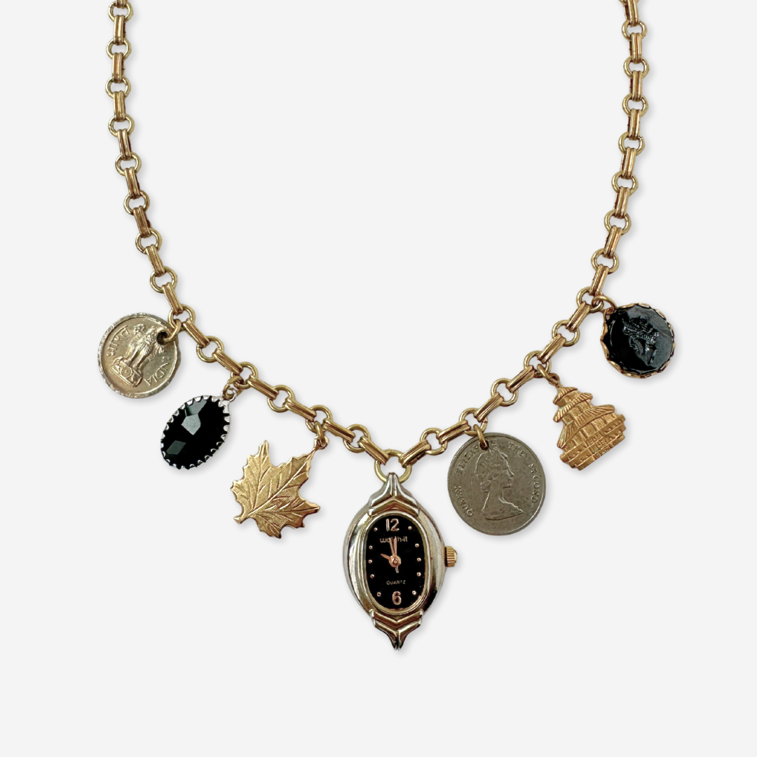Repurposed vintage mixed charm necklace on brass chain