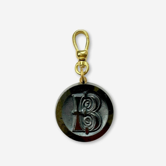 Vintage black glass orante letter "B" circular charm