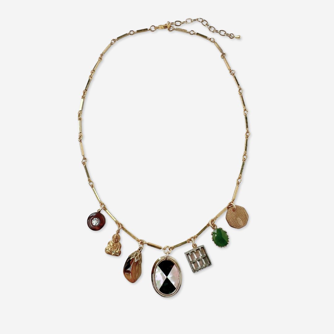 Repurposed vintage mixed charm necklace on gold bar chain