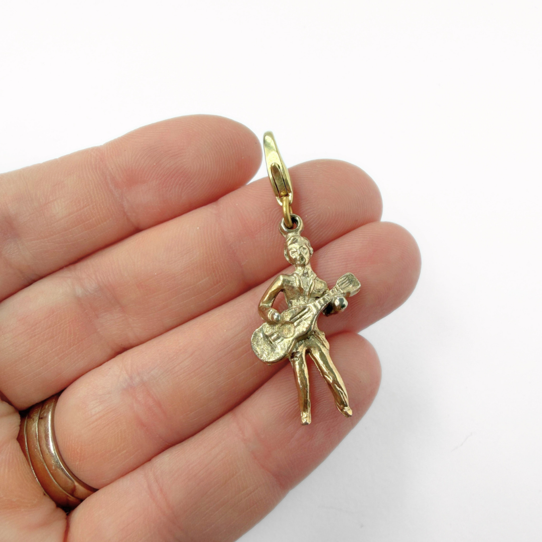 Vintage muted gold guitar player charm